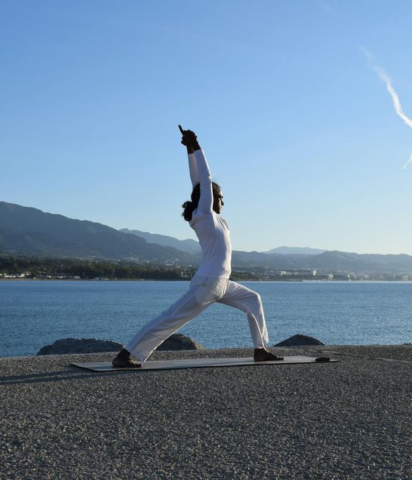 Man meditating peacefully after a workout session, showing mental clarity.